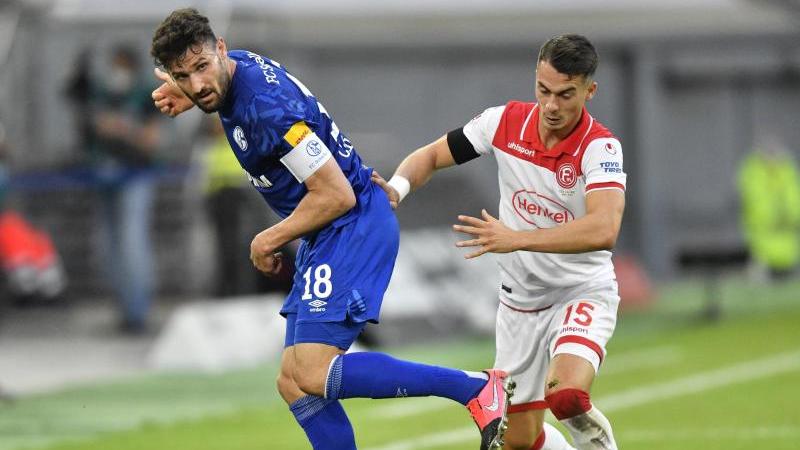 Der Schalker Daniel Caligiuri (l.) setzt nun in der Krise auf den Kampfgeist