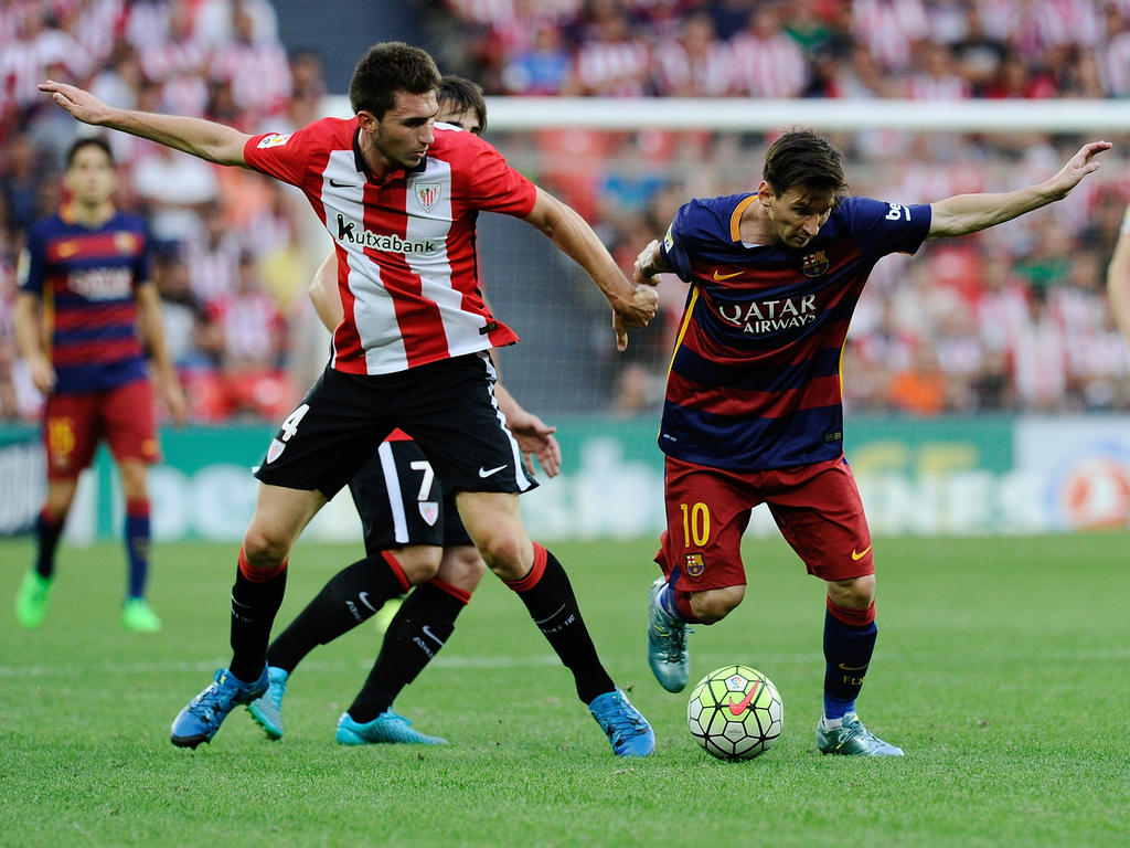 Aymeric Laporte (l.) im Duell mit Lionel Messi