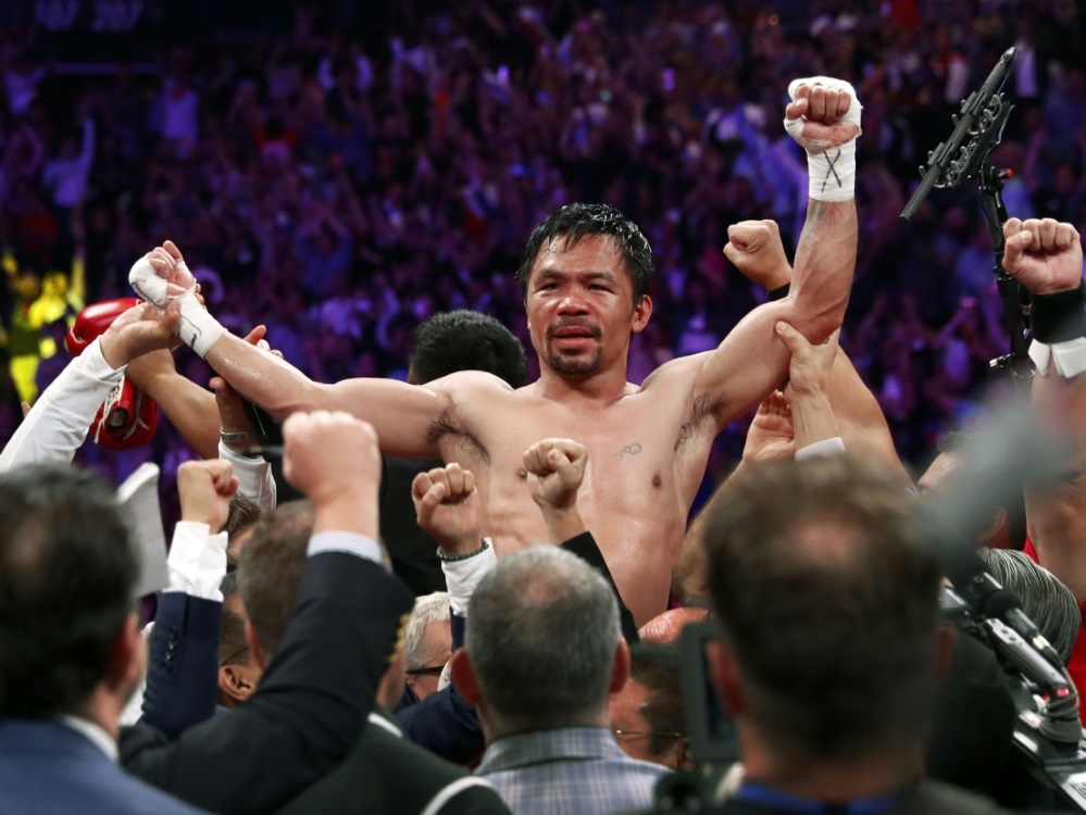 Manny Pacquiao feiert den Sieg über Thurman Manny Pacquiao feiert den Sieg über Thurman
