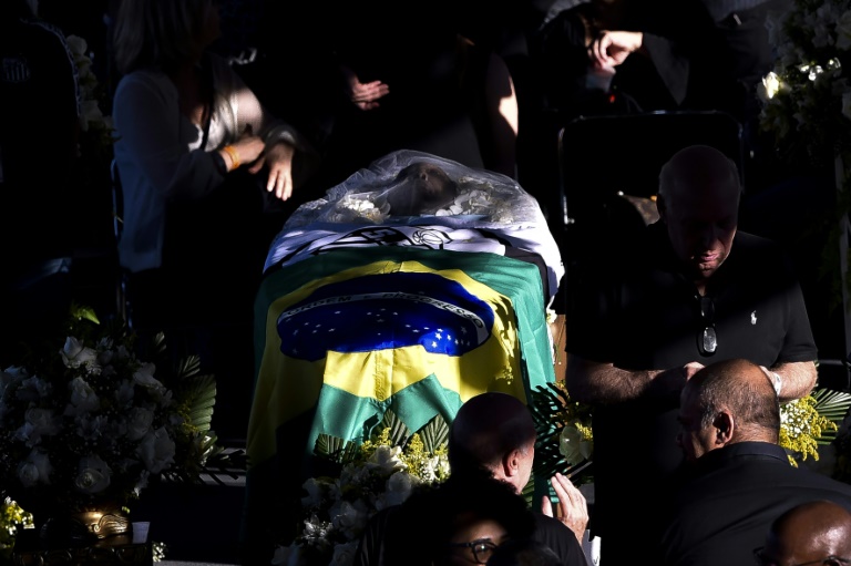 A flags of Brazil and Santos were draped across the coffin of Brazilian football legend Pele during his wake at the Urbano Caldeira stadium in Santos
