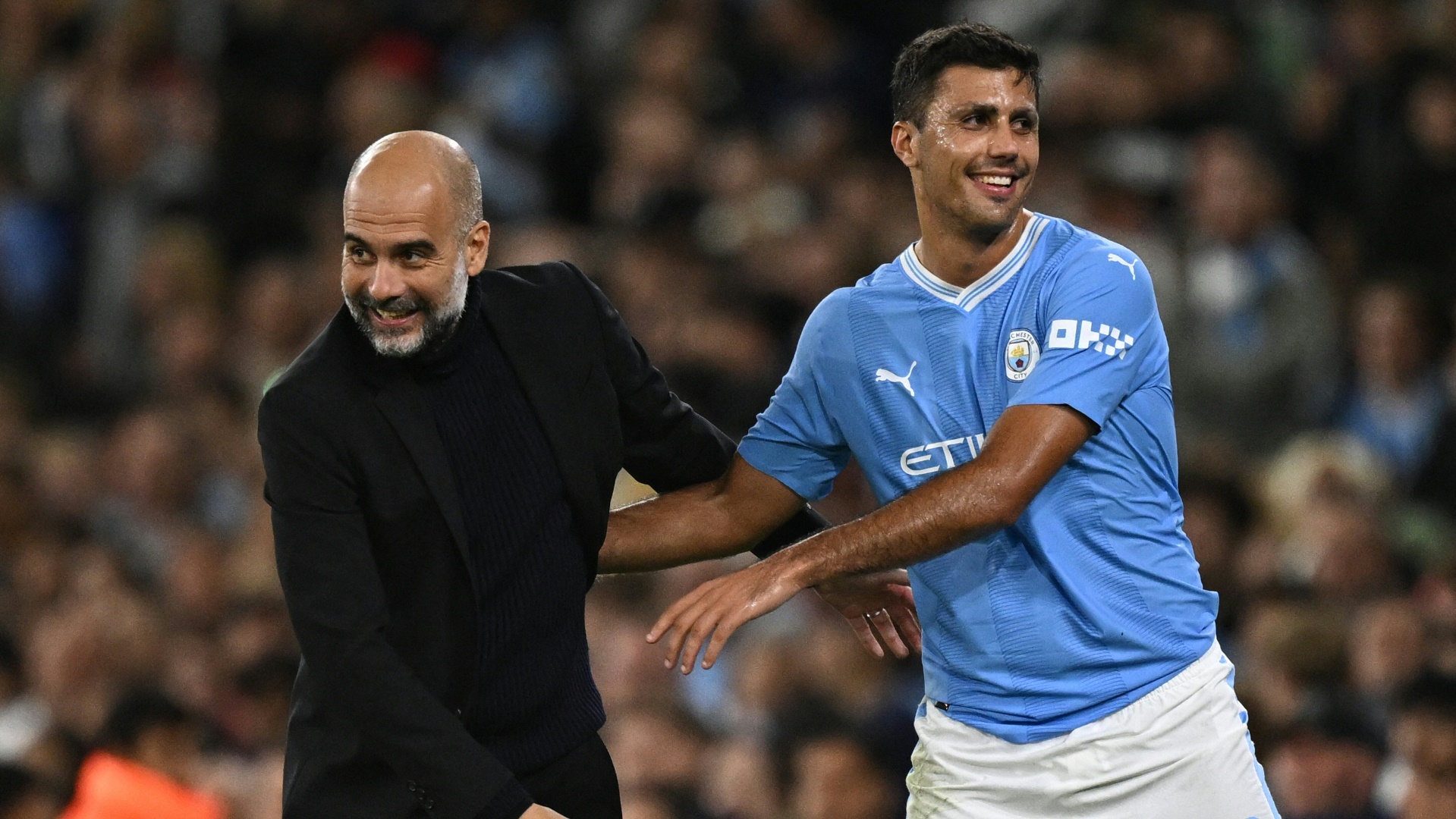 Seite an Seite: Pep Guardiola (l.) und Rodri Seite an Seite: Pep Guardiola (l.) und Rodri