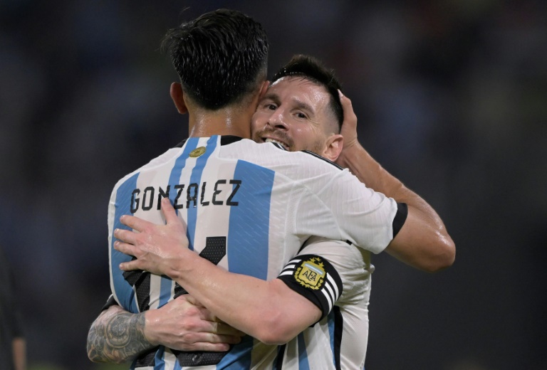 Football icon Lionel Messi (right) celebrates with Argentina teammate Nicolas Gonzalez after scoring against Curacao in which he reached 100 international goals