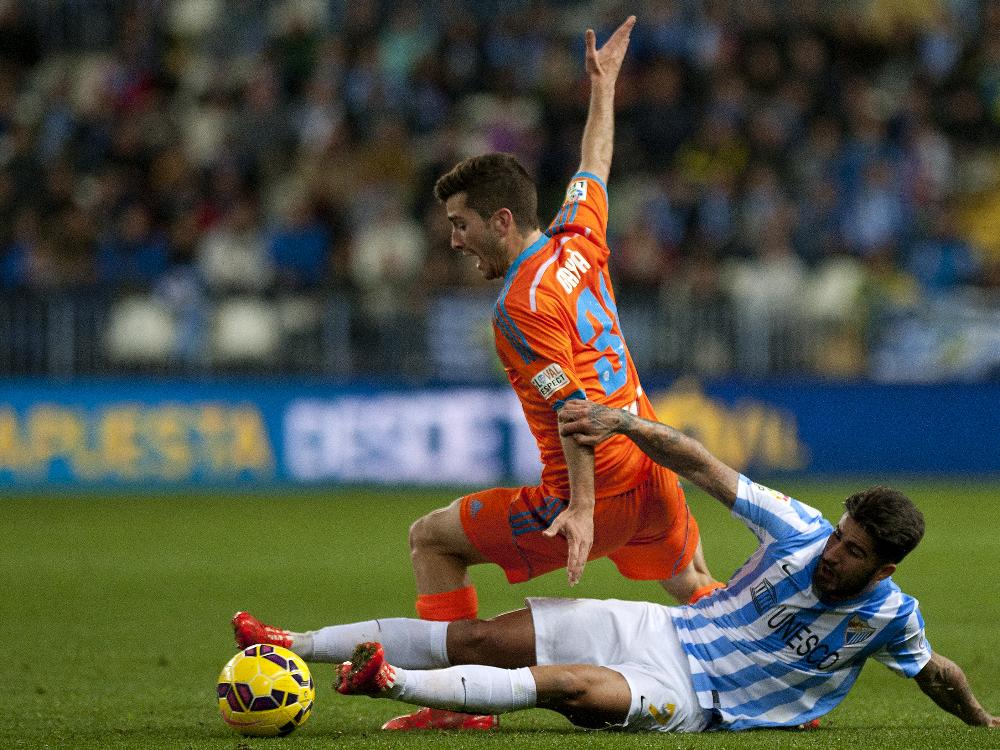 Der FC Valencia (o.) verlor in Malaga mit 0:1