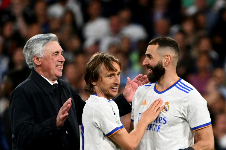 Real Madrid coach Carlo Ancelotti with Luka Modric and Karim Benzema after the Spanish club's stunning Champions League semi-final win over Manchester City