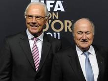 Franz Beckenbauer (l.) macht das System verantwortlich