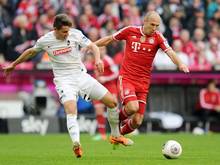 Christian Günter (l.) verlängert beim SC Freiburg