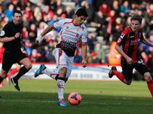 Luis Suarez (M.) steht mit Liverpool im Achtelfinale