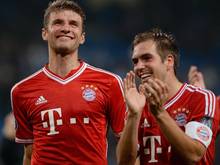 Thomas Müller (l.) und Philipp Lahm bleiben in München